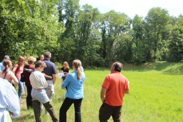 Jim Blanch (in background) explains Village Circle basin retrofit project.